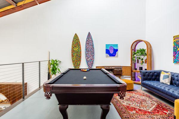 Pool table, art and upstairs lounge/loft