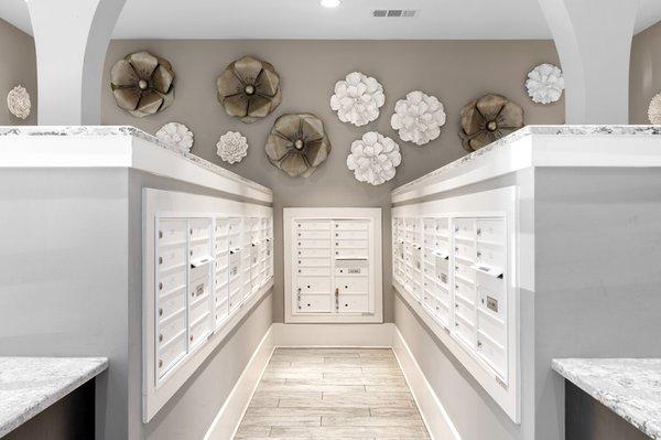 Mailroom at Lantower Weston Corners with large floral decoration on the wall.