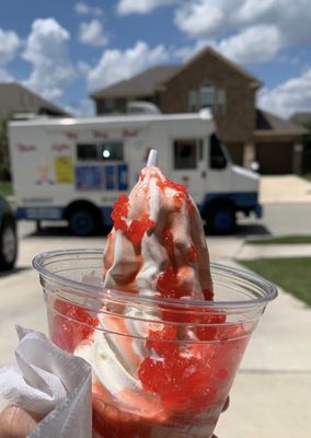 Vanilla soft serve with maraschino cherry topping