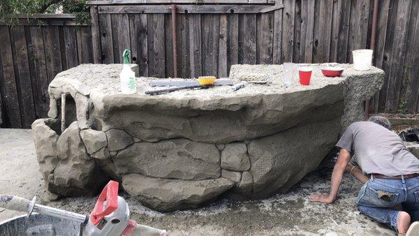 Outdoor hand carved concrete island