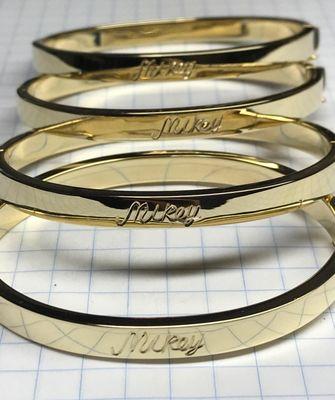 Customers signature, hand engraved. (customer supplied bracelets).