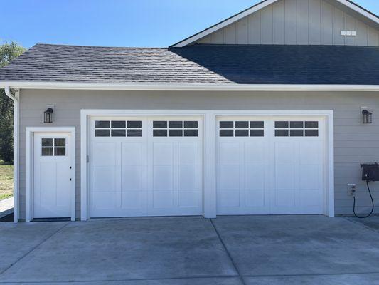 These overlay carriage house garage doors worked perfectly with the entry door.