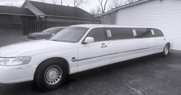 Phenomenal white stretch limousine 12 passenger luxury vehicle available for upcoming events.