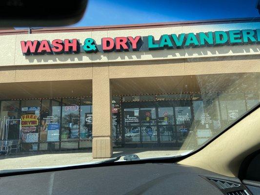 The outside entrance of the laundromat