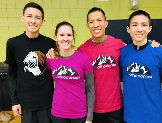 Dr. Eng, his wife Rachel, and two of their sons after running the Brighton Turkey Trot.