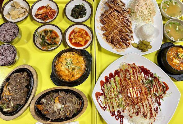 Kimchi Stew, Seafood Tofu Soup, Bulgogi, Spicy cold noodles, pork Katsu and some side dishes.