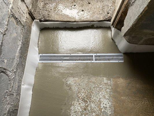 Bulkhead entrance done! Grate install to collect any water coming from the bulkhead stairway