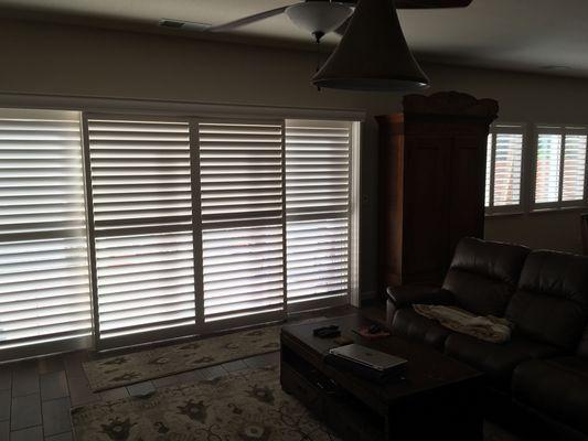 Eclipse Shutters Bypass track system over large sliding door. 3 1/2 " Louvers, UltraClose operating system.