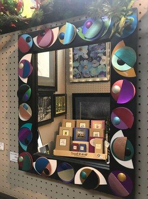 This mirror is handmade out of upcycled CDs.