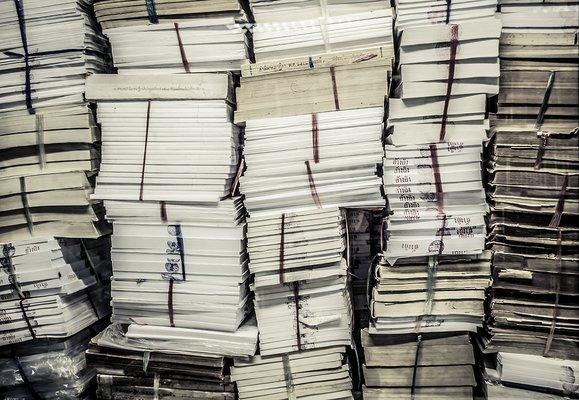 Stacks of paperwork that need shredding