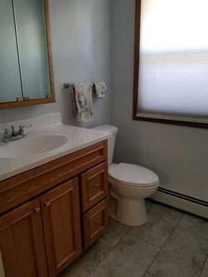 Installed new vanity, floor, toilet, in our clients bathroom.