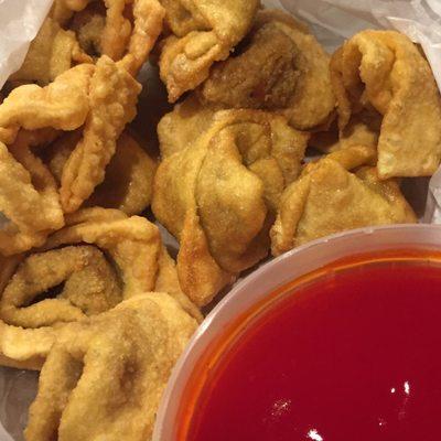 Crispy fried wonton with thick neon sweet and sour dipping sauce