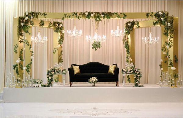 Arch trussing,gold lame fabric,chandeliers