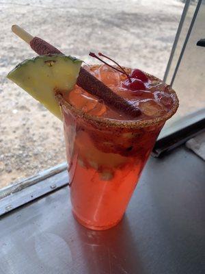 Prickly Pear Lemonade with pineapples and cherries with our Homemade Chamoy RimDip