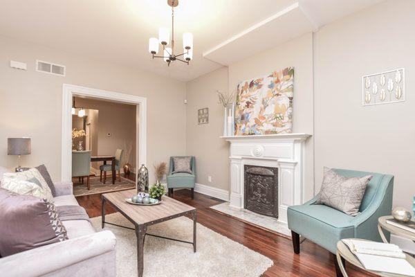 Original wood flooring was refinished and a fireplace mantle was added & re-tiled to capture the home's historical charm.