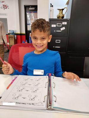 A mathlete smiling because he understands his math.