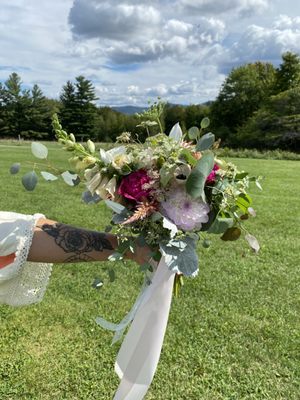 Airy, sprawling, high summer hand- tied wedding bouquet.