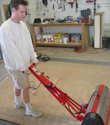 A critical step in cleaning rugs is to remove the dry particulate soil.