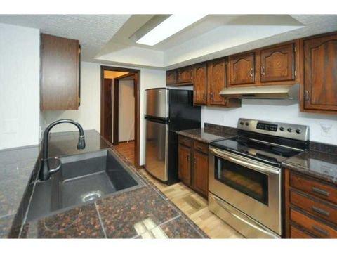 Before: Dark antiqued wood cabinets