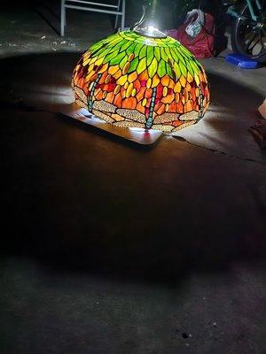 Tiffany style
 dragonfly lamp
 approximately 23 in.  across center and approximately 12-14 in. tall. Unique turquoise body  on dragonfly