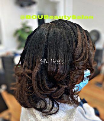 Silk Press on natural curly hair done by Hans-Berthe