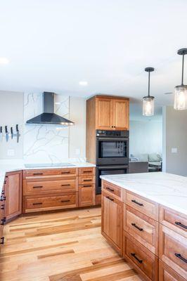 A touch of modernity: This kitchen blends rustic wooden textures with contemporary appliances and lighting.