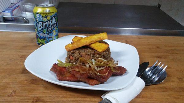 Latin fried rice plantains and pork chops