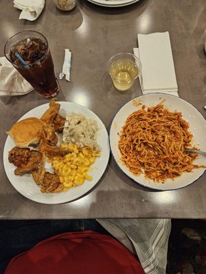 Chicken, potatoes, Mac n cheese, chicken spaghetti, roll, Moscato, and Arnold palmer.