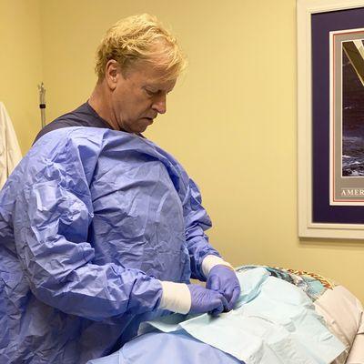 Dr. Childers providing treatment to a patient