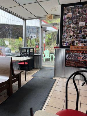 Cozy eating area. Check out the photo neighborhood board. Well loved institution.