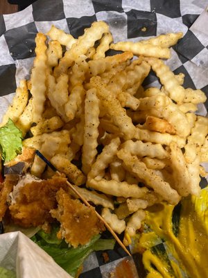 All the stuff on the fries is from an unclean fryer. Tastes of burnt onion rings and fryer muck.