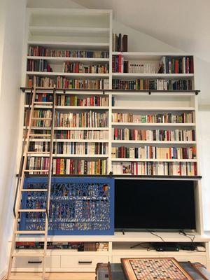 A very tall built-in bookcase