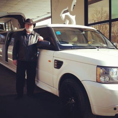 Leon our driver by our white Range Rover limousine painted by the paint spot http://exoticcoachchicago.com