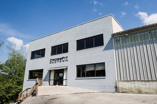 Our building (view from our parking lot) - workout facility located down the stairs; lobby/bathrooms/childcare room through those doors