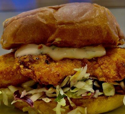 Southern style fried chicken sandwich  W Serrano & lime slaw on brioche bun