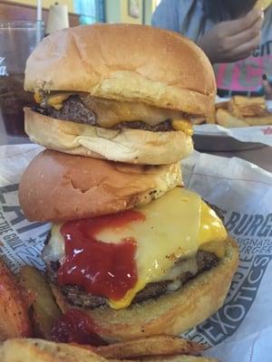 1/2 lb 3 cheese burger atop a 2/3 lb 3 cheese burger