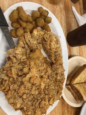 Chicken fried steak with fried okra and a side of Texas toast