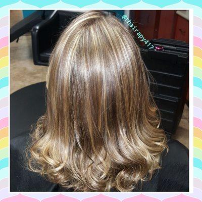 Light golden blonde full Foil highlights on a natural level medium blonde.