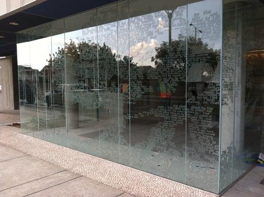 Sandblasted text / design on exterior glass wall at the University of Arizona.