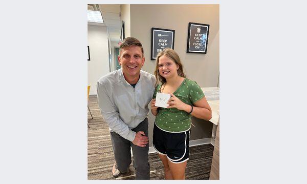 Dr. Carlson giving away one of our contest prizes, airpods for the win! We love to have fun contests for our patients to participate in.