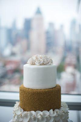 June 2018 Wedding.  Vanilla Cake, Raspberry Filling with White Chocolate Buttercream.  Covered in Fondant.