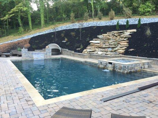 Spill over spa with rock water feature to compliment