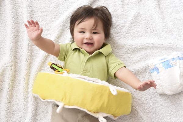 Snuggwugg will be your baby's favorite interactive pillow. Attach toys or pacifiers or add your smartphone!