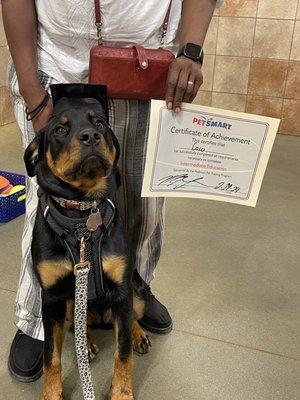 Coco with graduation certificate