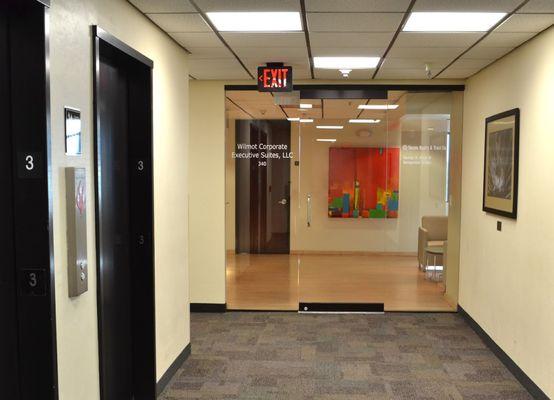 From the elevator, turn left and enter suite 340 Wilmot Corporate Executive Suites at the glass door.  A receptionist is there to greet you.