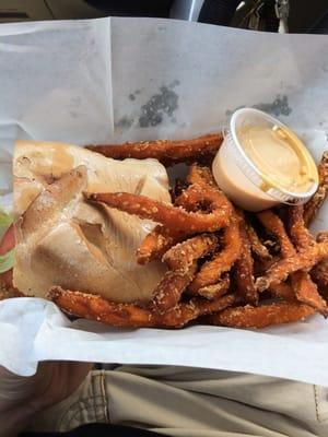 Trout po boy and sweet potato fries with awesome sauce