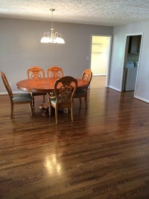 New hardwood flooring installed, finished and baseboards installed and painted.