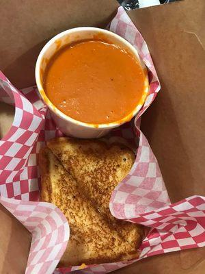 Homemade tomato soup and grilled tomatoe basil cheddar cheese