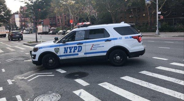 Police turning left at 1st and 5th - not in the "turn lane".  Do as they say not as they do, unless you want a ticky.