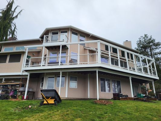 After Jon repaired everything, we got the house painted.  The deck is gorgeous!